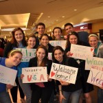 Ty and McKenzae's immersion group made signs to greet incoming refugee families.